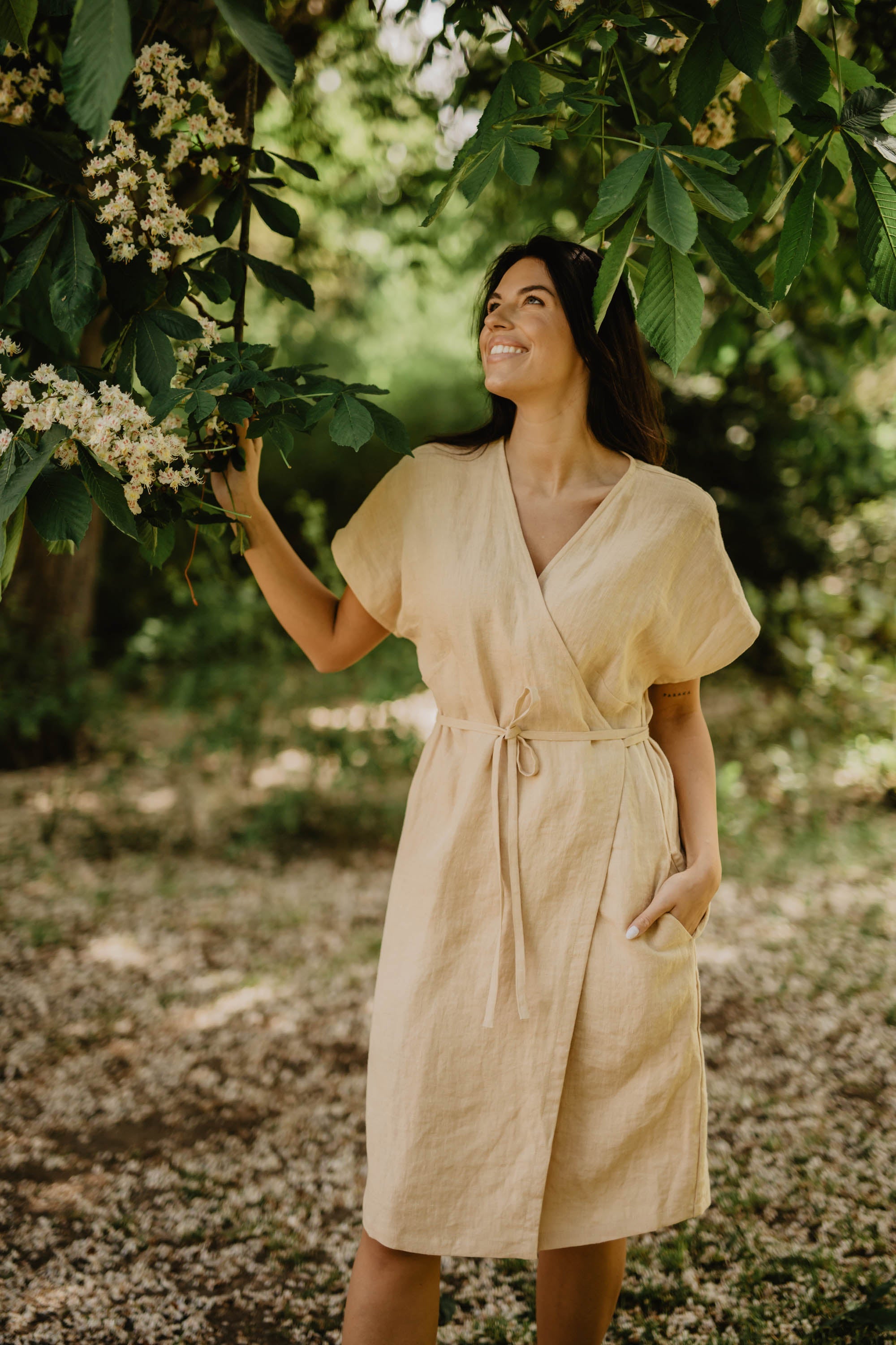 Women in Yellow Linen Dress Holding A Tree Branch