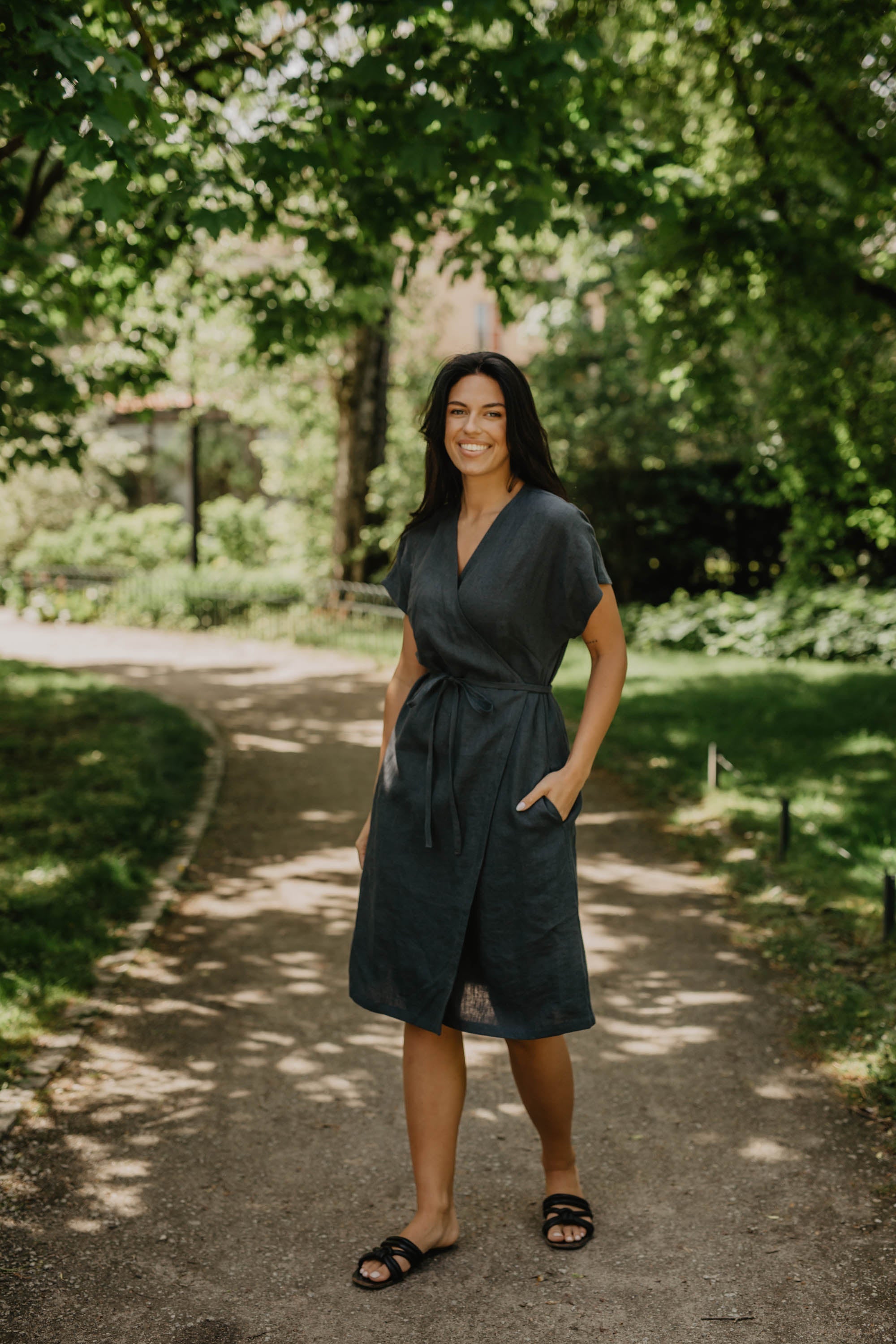 Women Wearing A Black Linen Wrap-Dress Walking in A Park