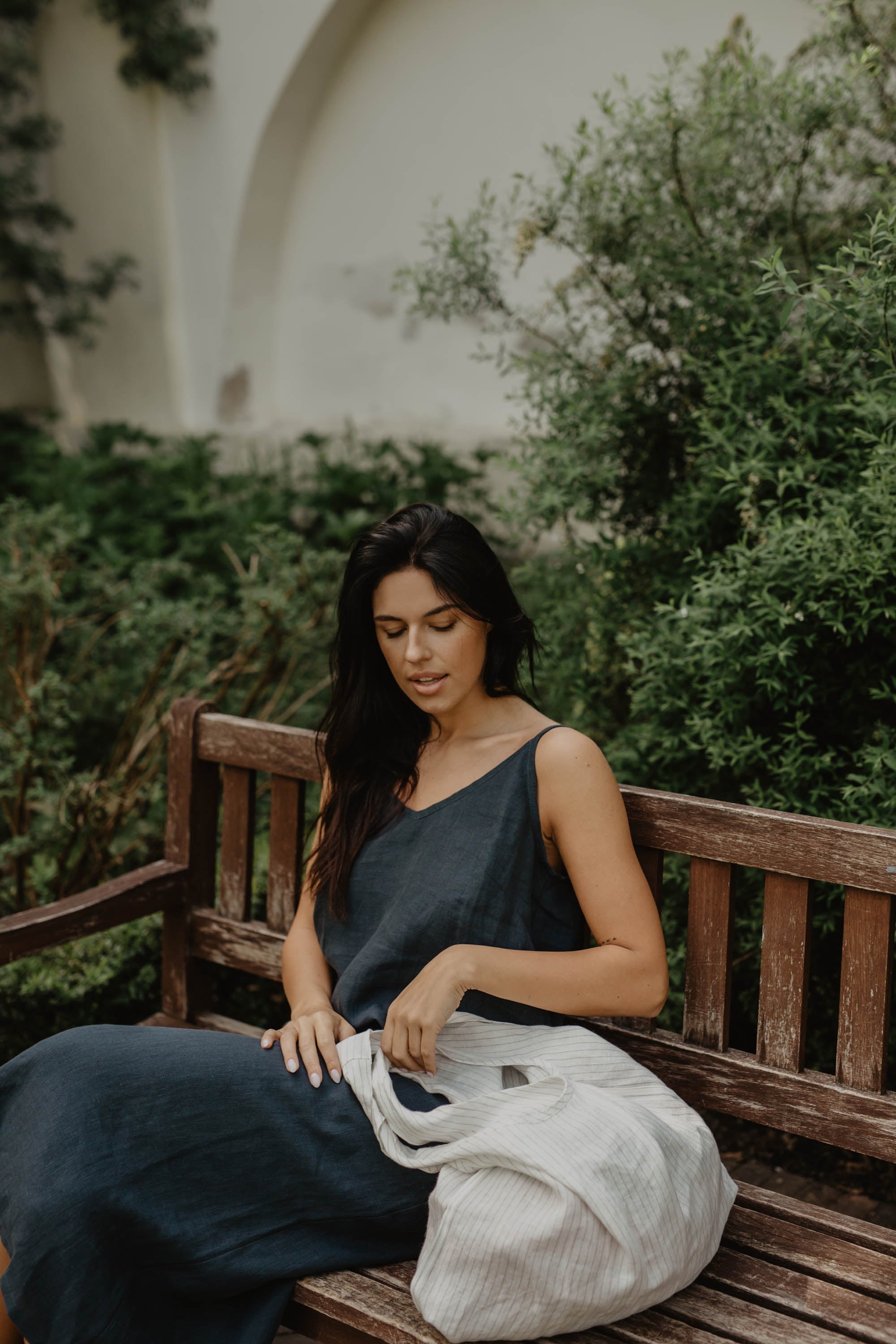Woman Sitting On Bench With A White Linen Tote Bag BY Amourlinen