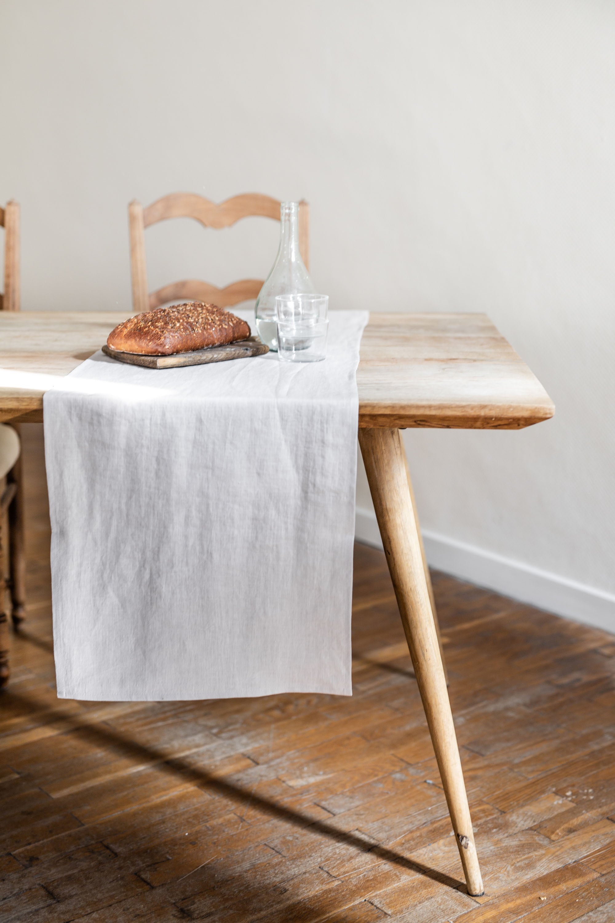 Side View Of Dinner Table With Cream Linen Table Runner By AmourlInen