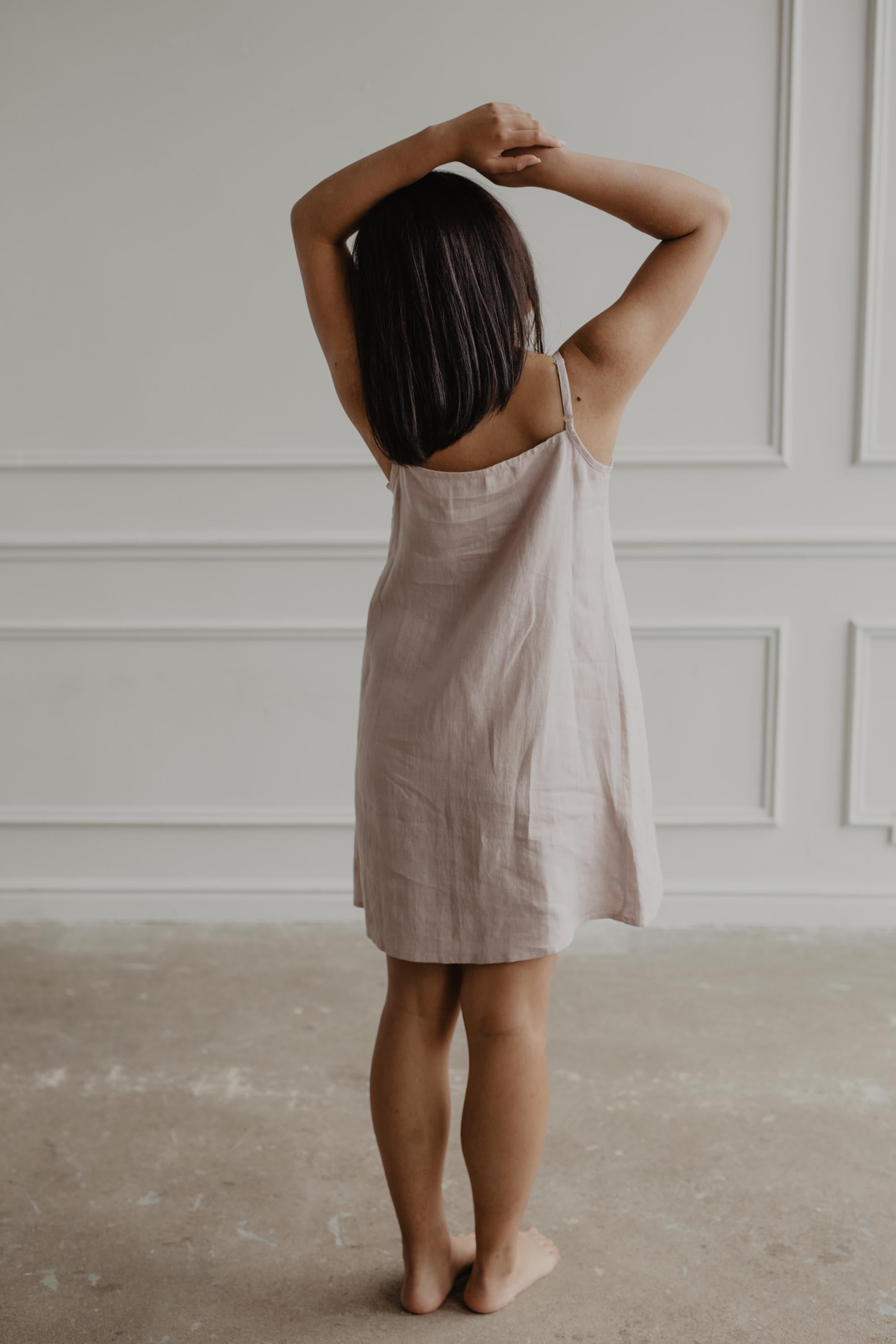 Back Of Woman Wearing White Linen Night Gown By AmourLinen