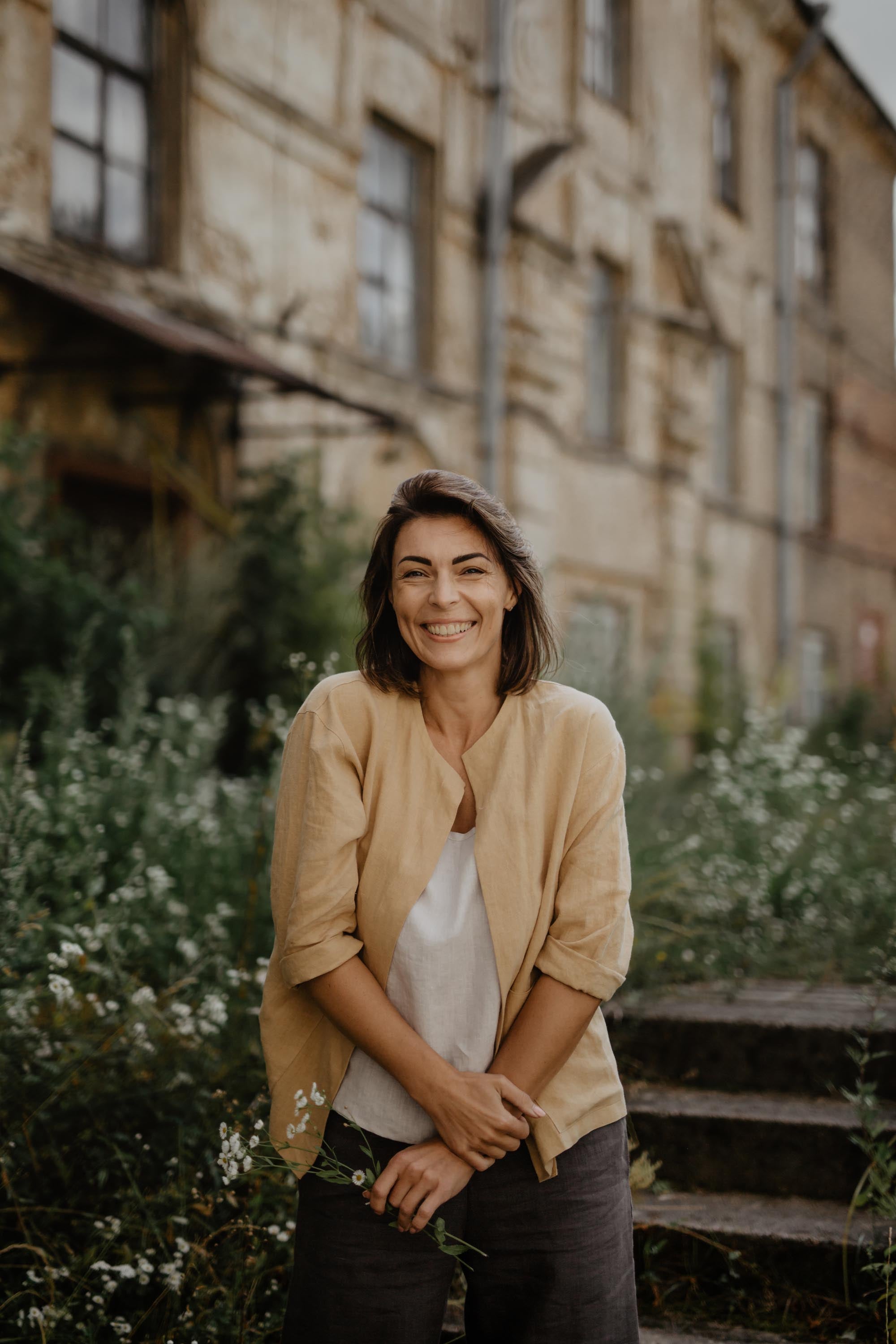Woman Smiling Wearing Mustard Color Oversized Linen Jacket By AmourLinen