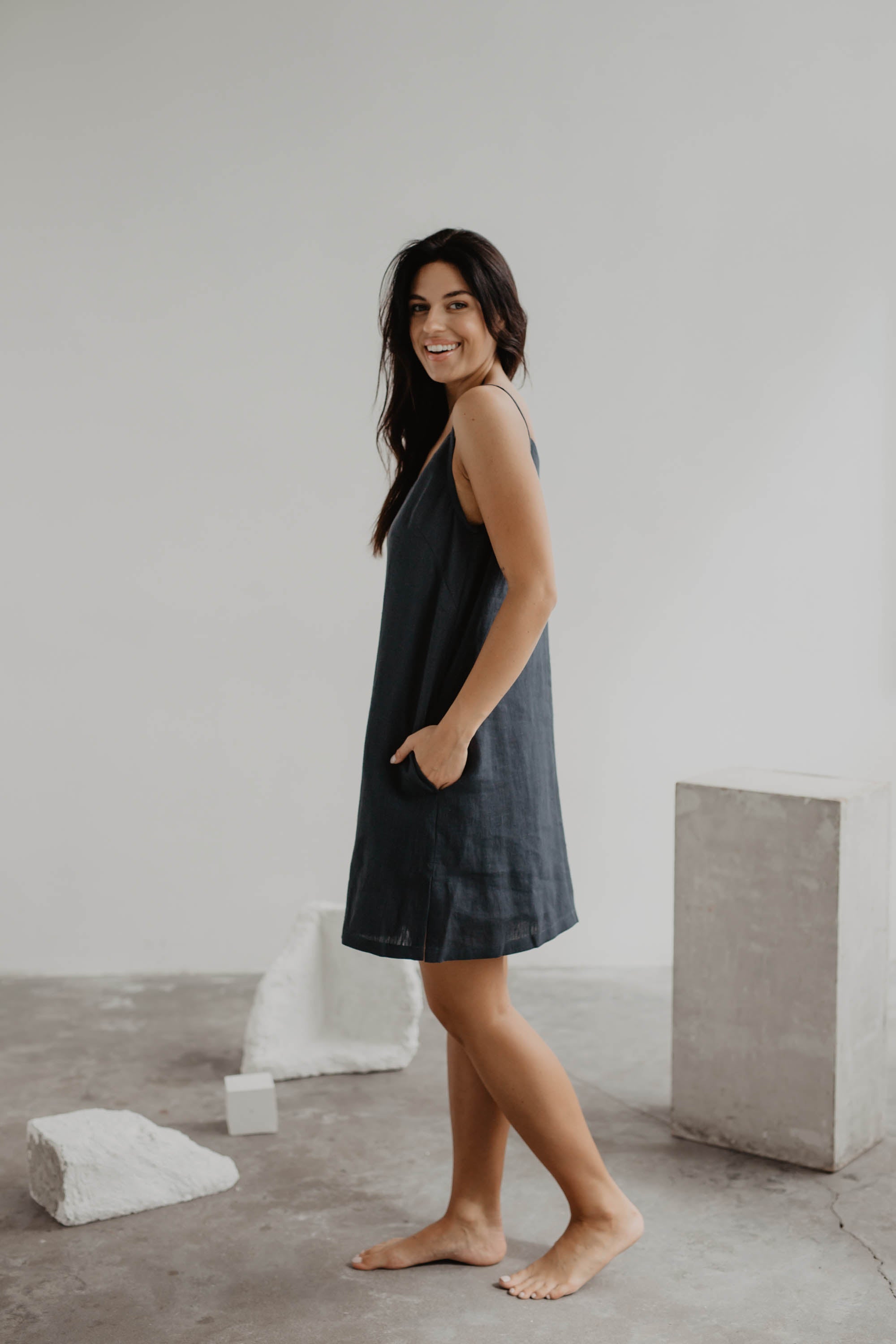Side View Of Women Wearing A Black Linen Slip Dress by Amourlinen