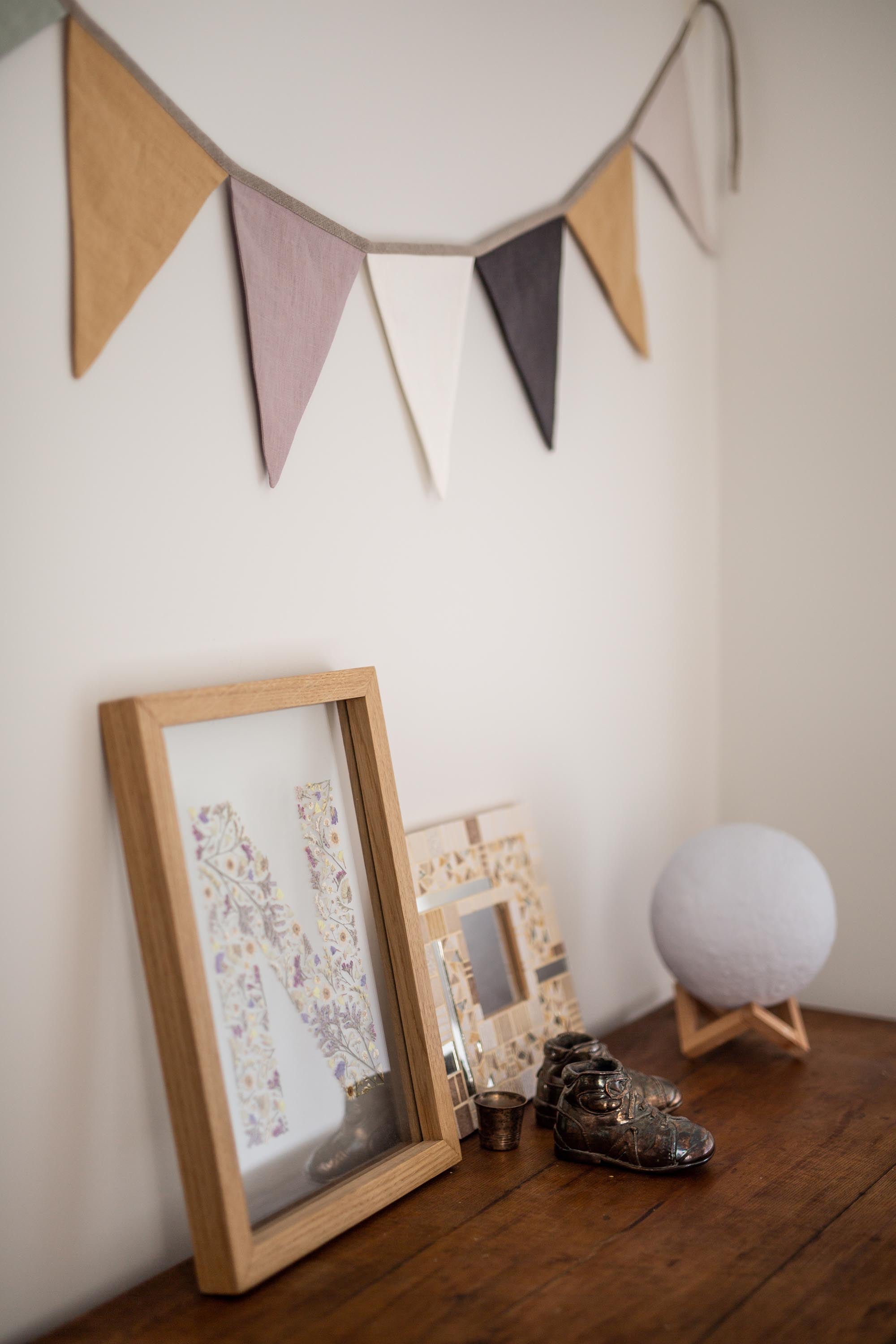 Neutral Color Linen Baby Bunting Next To Other Accessories
