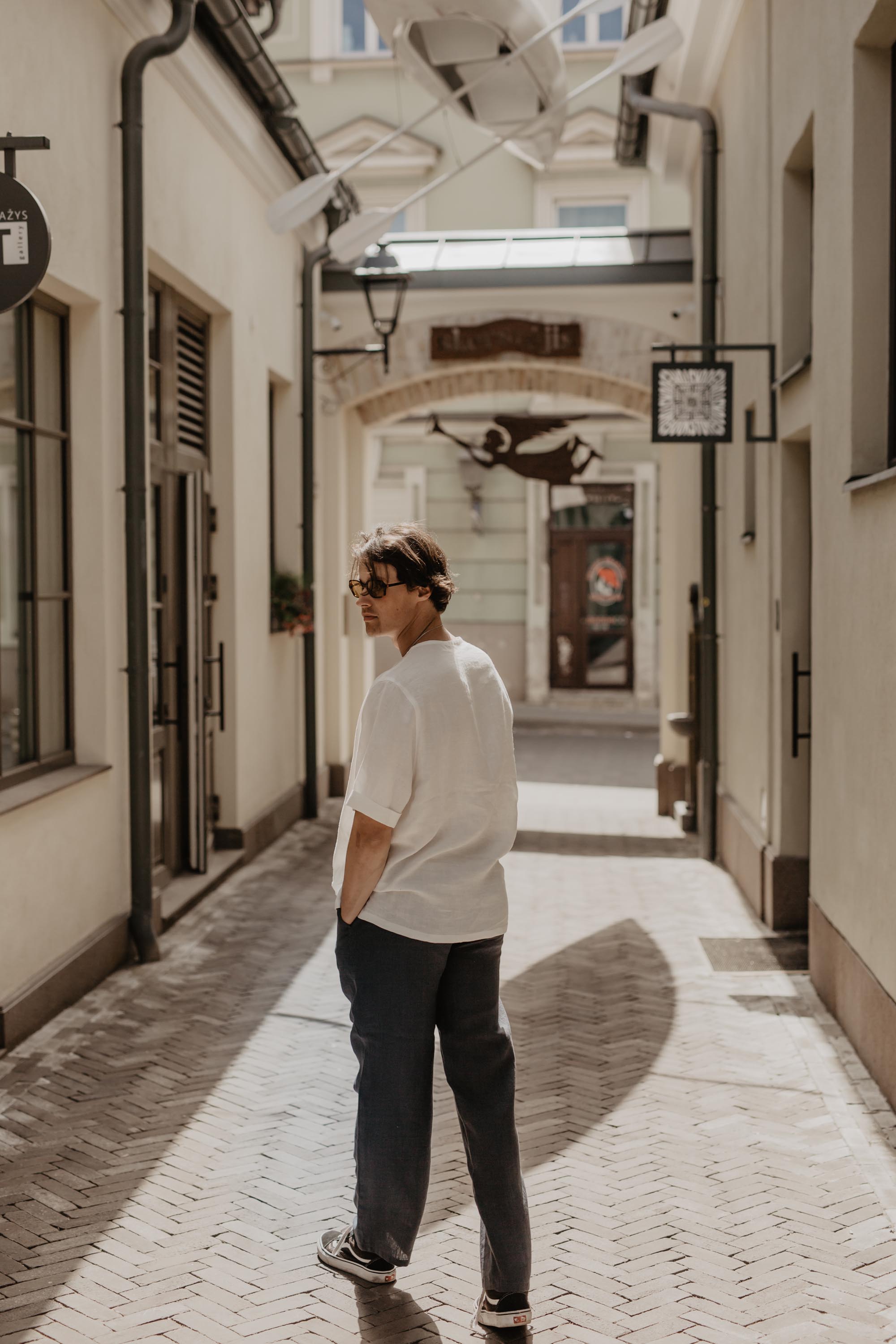 Man Looking Back with Black Linen Pants and White Shirt