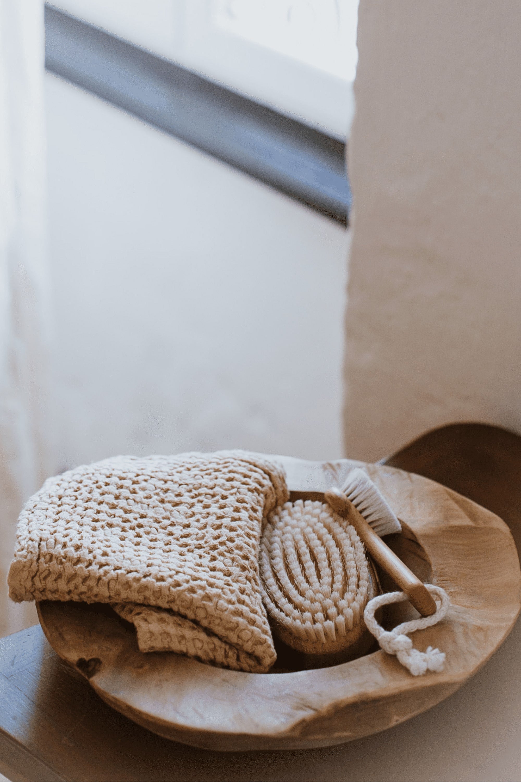 Mustard Linen Face Towel With Brushes In A Wooden Bowl