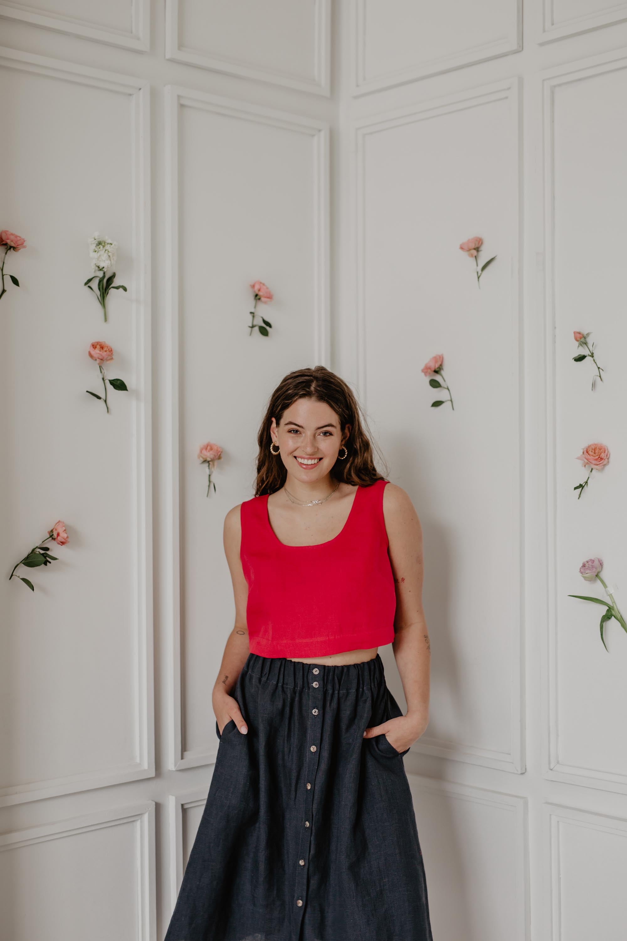 Woman Wearing Red Linen Crop Top And Dark Linen Skirt