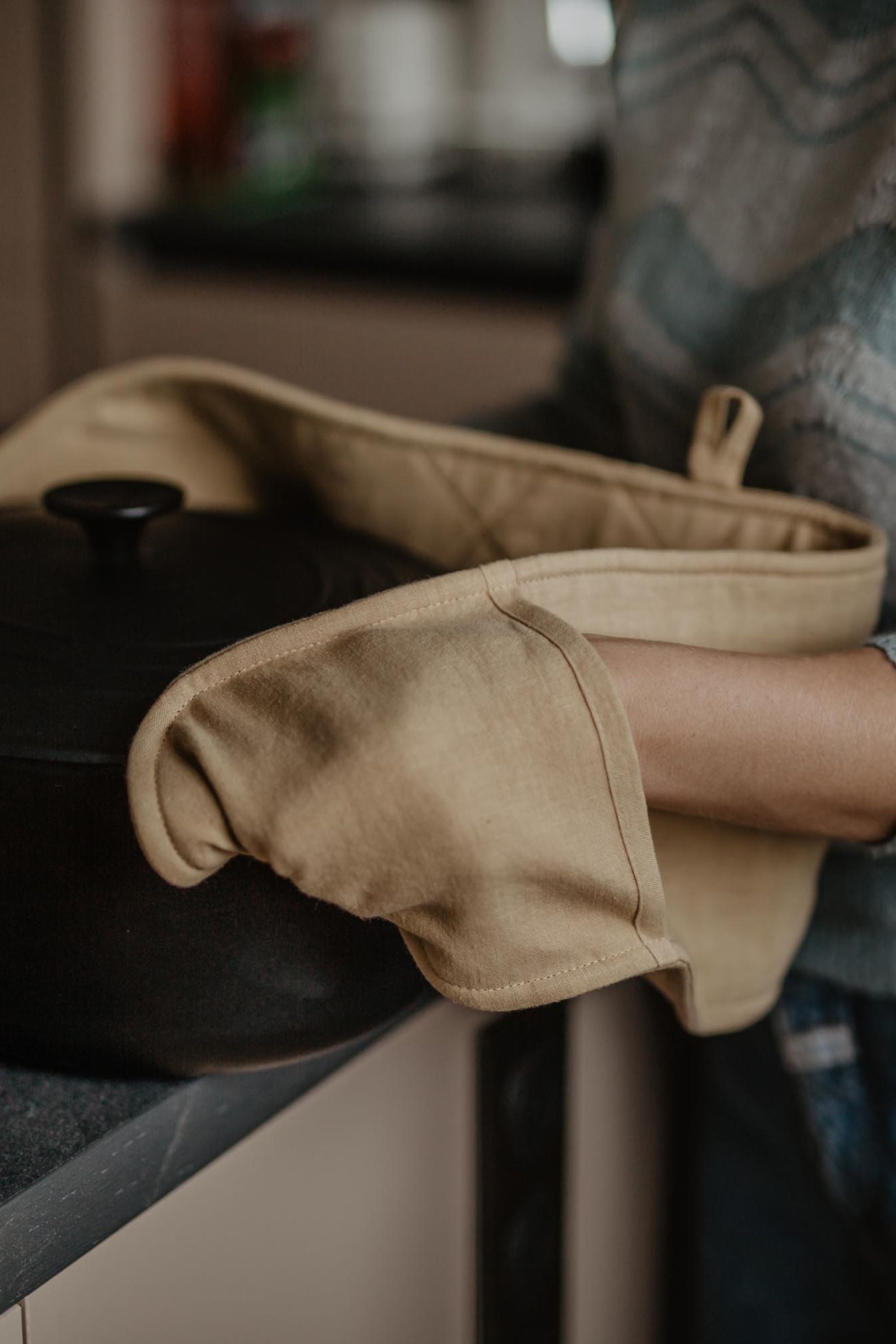 Picking up A Pot With Mustard Linen Double-Oven Mitt By AmourlInen